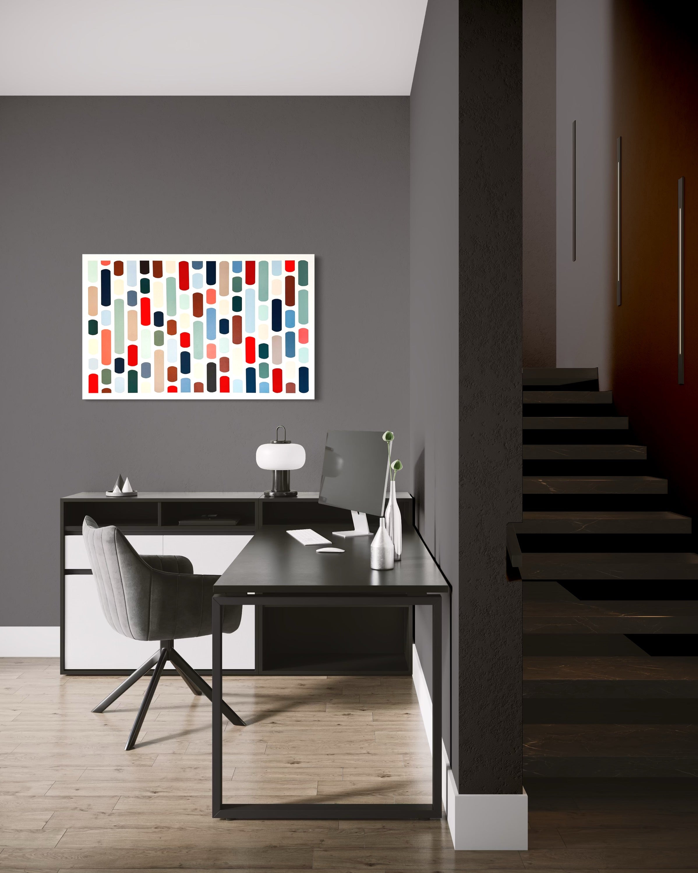 Modern office interior with a desk, chair, and abstract wall art.