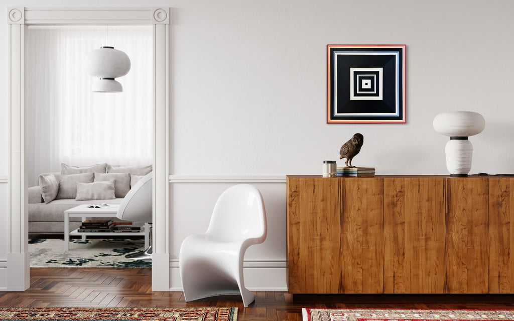 The "Black-and-Peach" painting adding a touch of modern elegance above a warm, mid-century style wooden credenza.