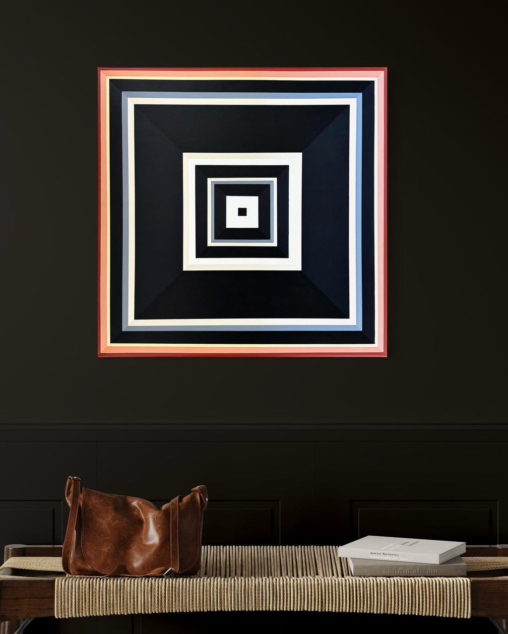 dramatic in-situ view of the "Black-and-Peach" painting, where its light center glows against a dark, textured interior wall.