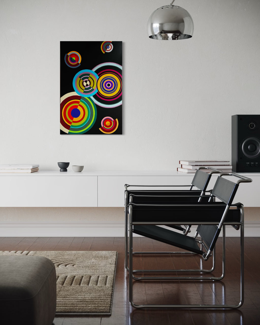Modern living room with a colorful abstract painting on the wall, black chairs, and a rug.