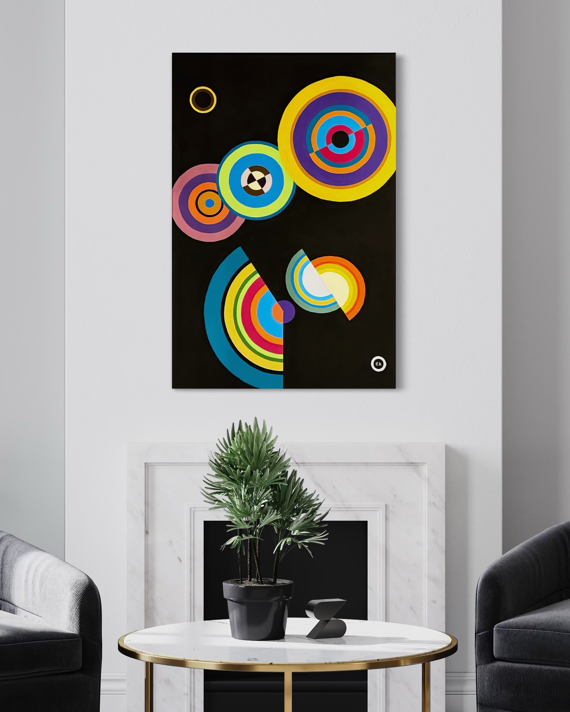 Abstract colorful art piece on a wall above a table with a plant and decor items.