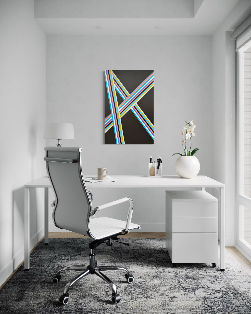 Modern office desk with chair, lamp, and decor in a bright room.