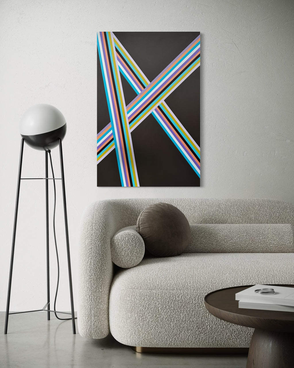 Abstract art piece with colorful lines on a wall above a sofa in a modern living room.
