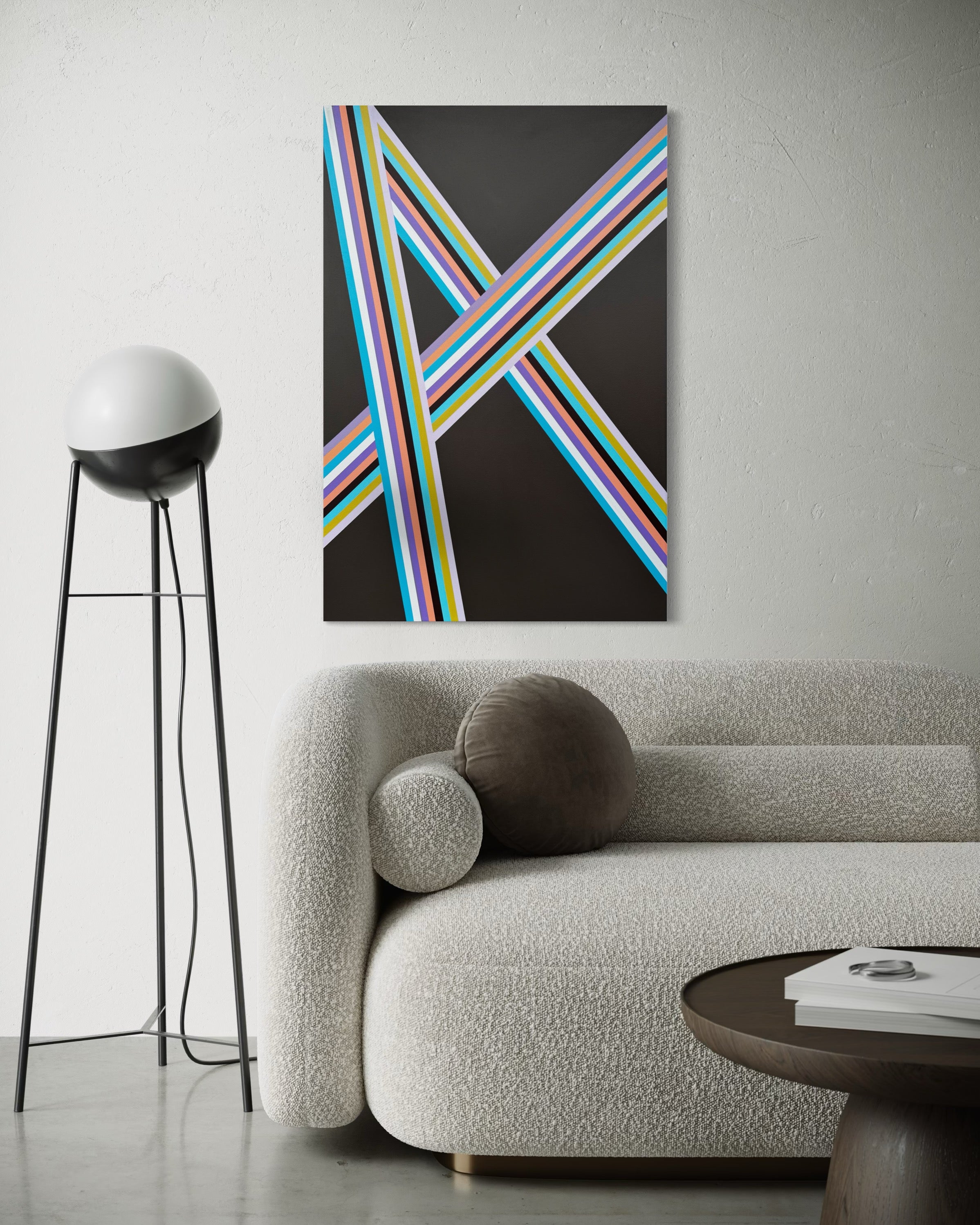 Abstract art piece with colorful lines on a wall above a sofa in a modern living room.