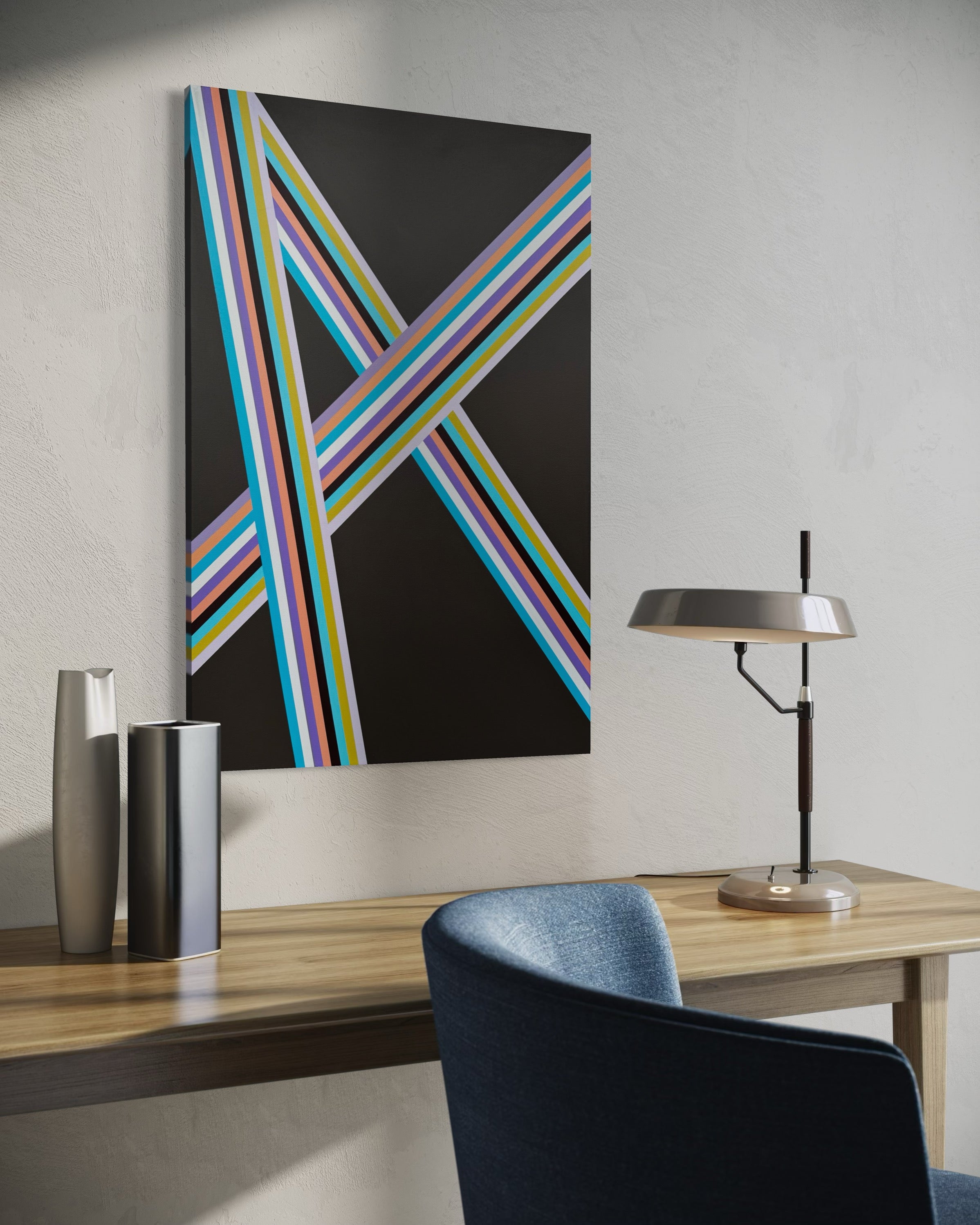 Modern interior with a colorful abstract painting on a wall above a desk.