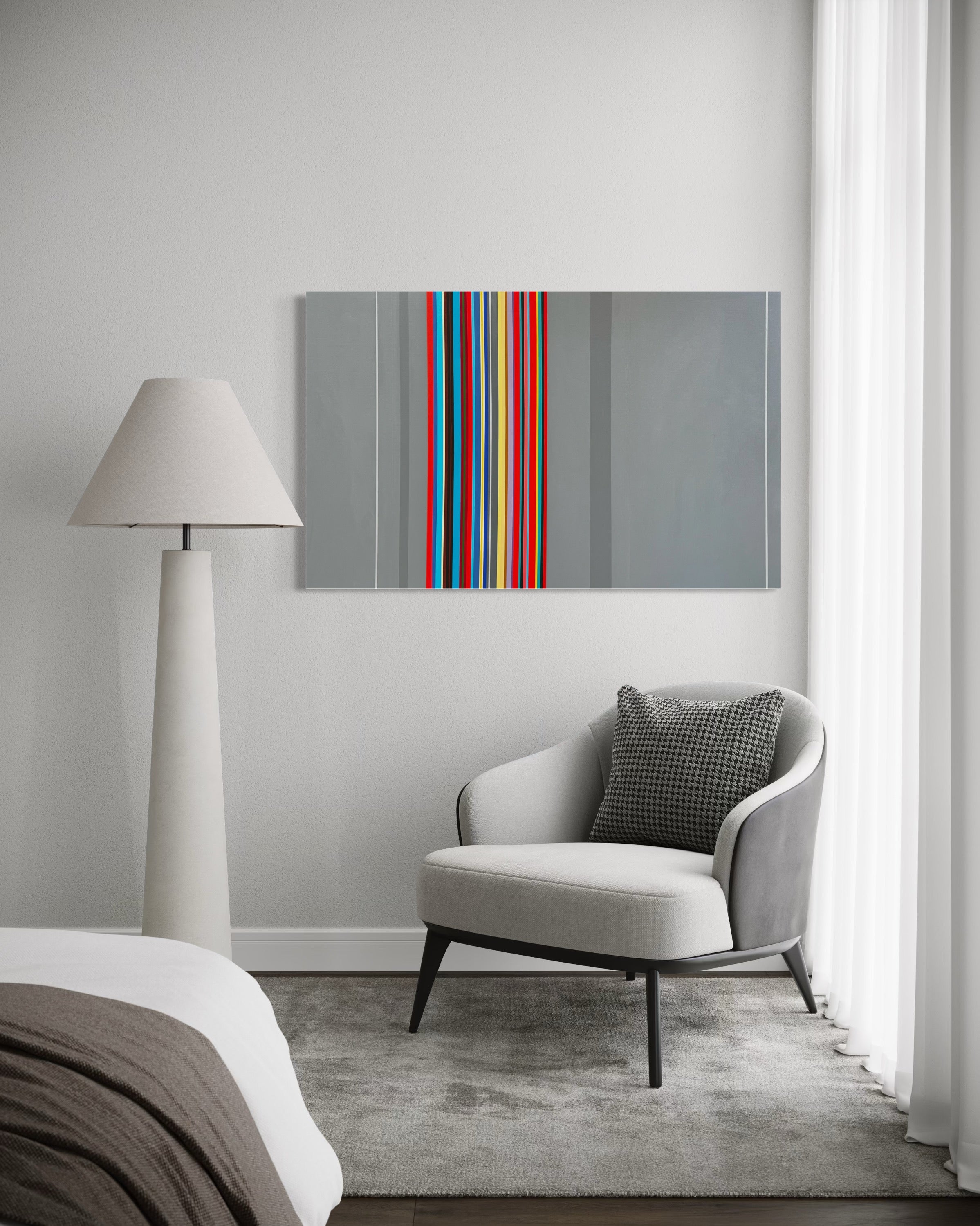 Modern interior with a gray armchair, lamp, and abstract art on the wall.