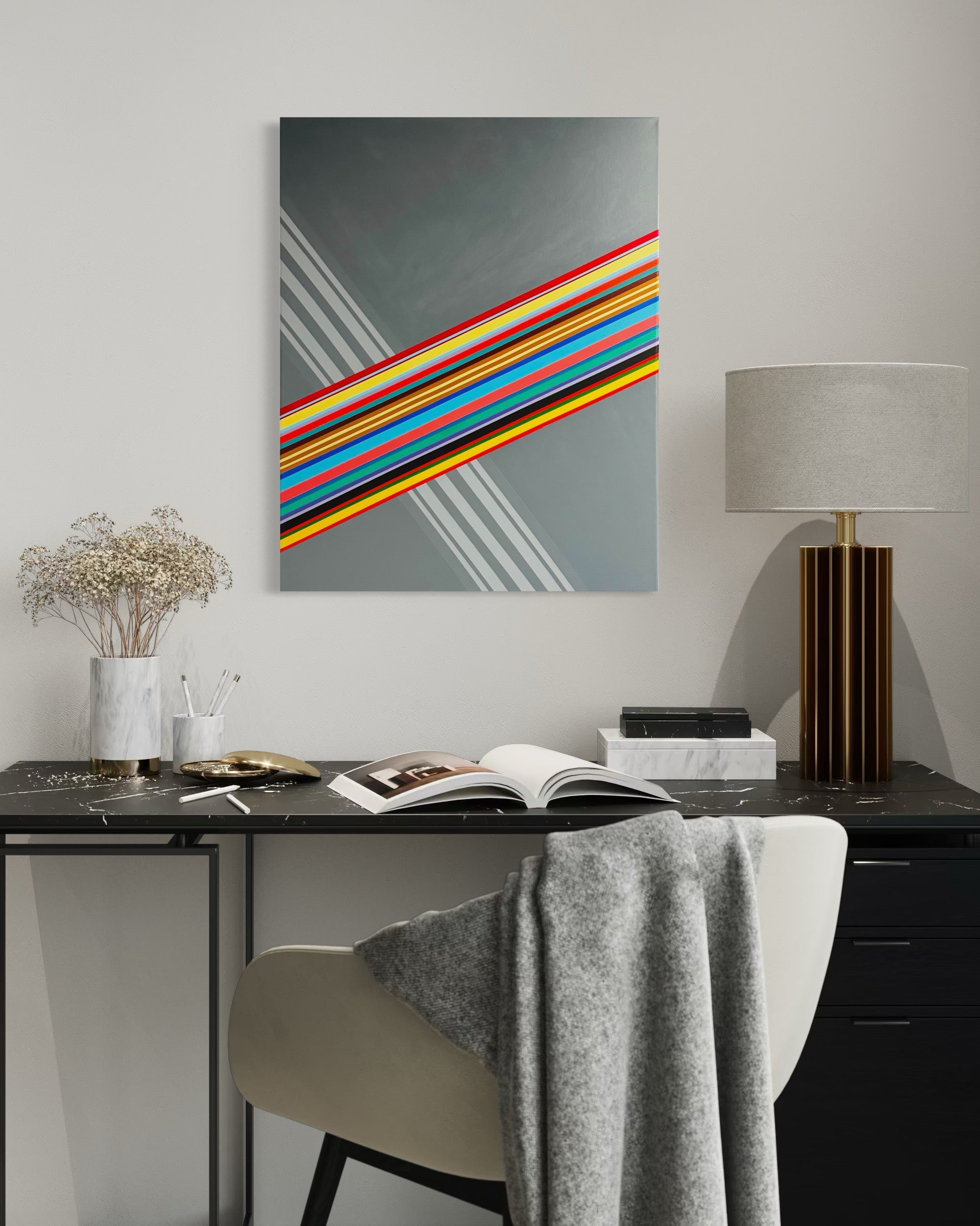 Modern interior with a desk, chair, lamp, and abstract art on the wall.