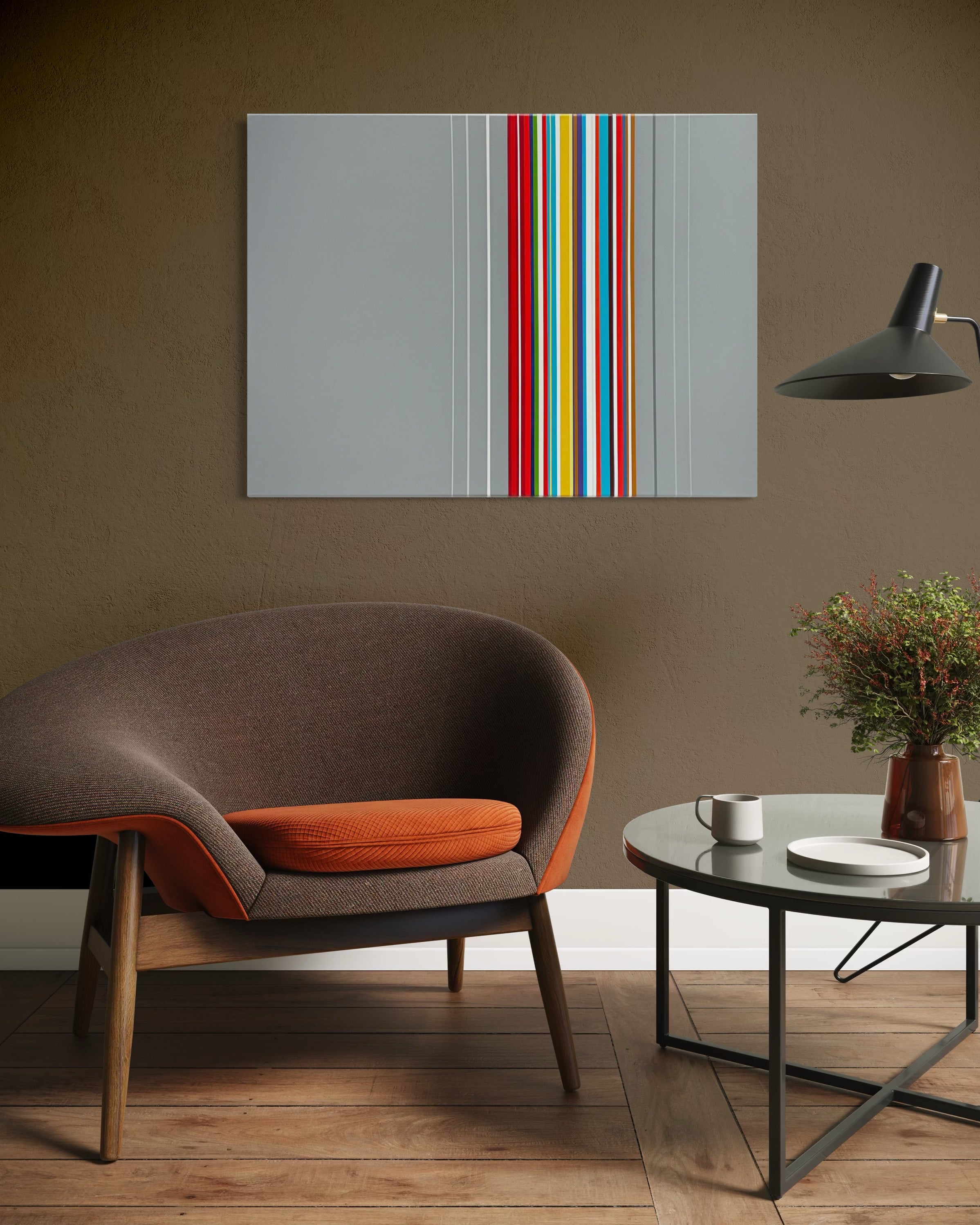 Modern living room with a brown armchair, coffee table, and abstract art on the wall.