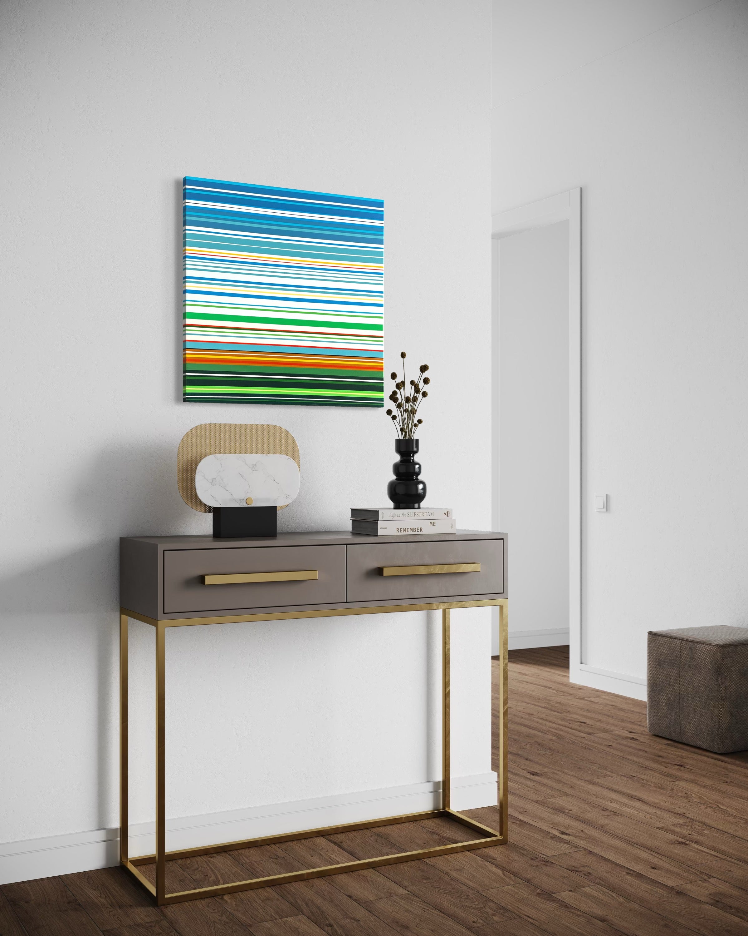 Modern console table with decorative items and a colorful abstract painting in a minimalistic room.