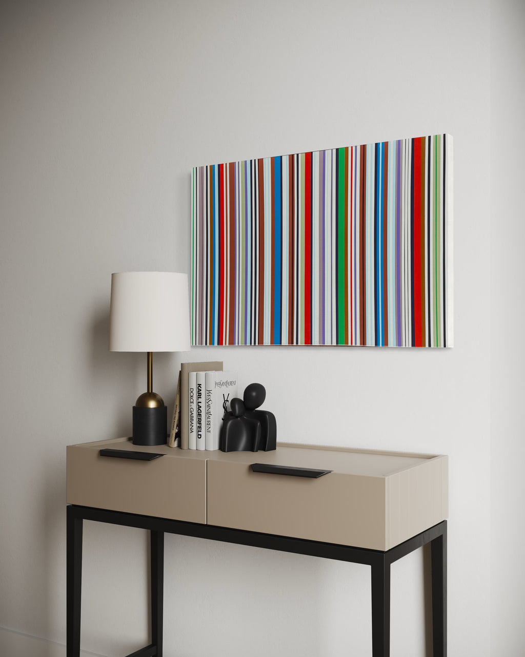 Modern interior with a console table, lamp, books, and decorative items under a colorful striped painting.