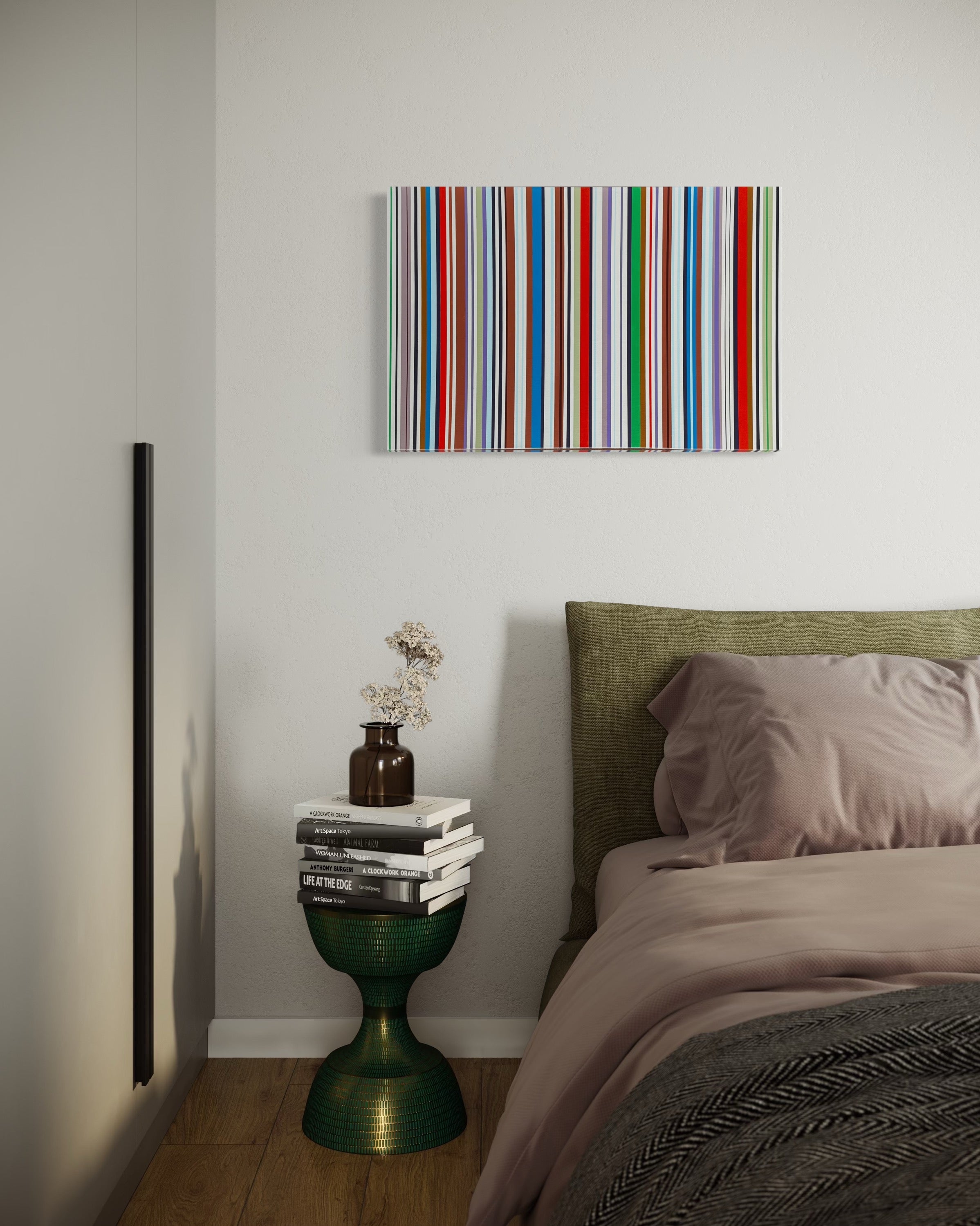 Bedroom with a colorful striped painting on the wall, a bed with green headboard, and a small table with books and a vase.