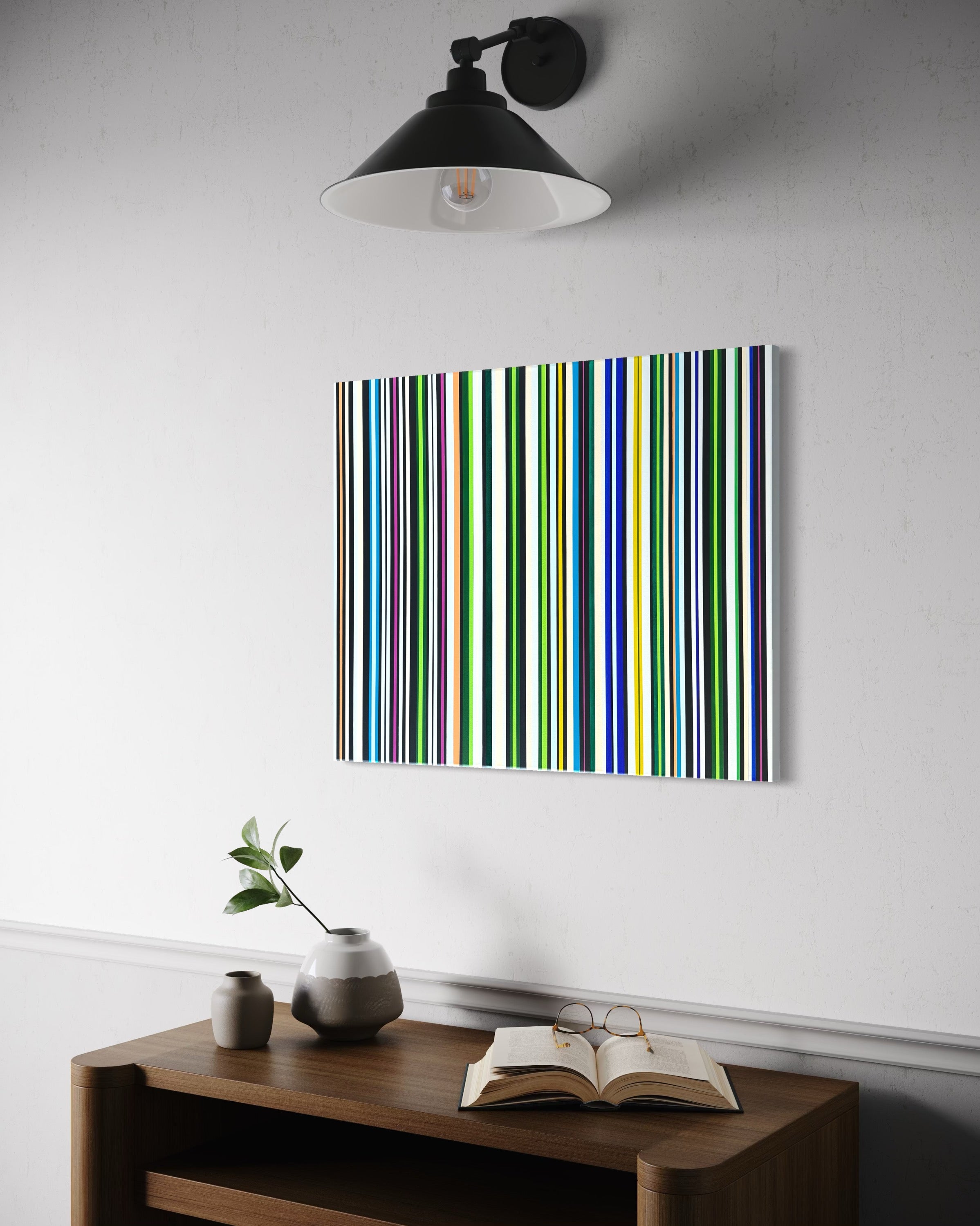 Colorful striped painting on a white wall above a wooden shelf with decor items.
