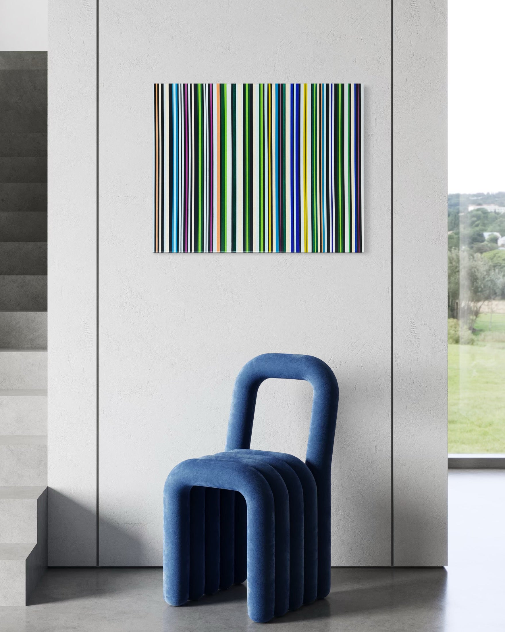 Blue chair in a room with a colorful barcode-style artwork on the wall.