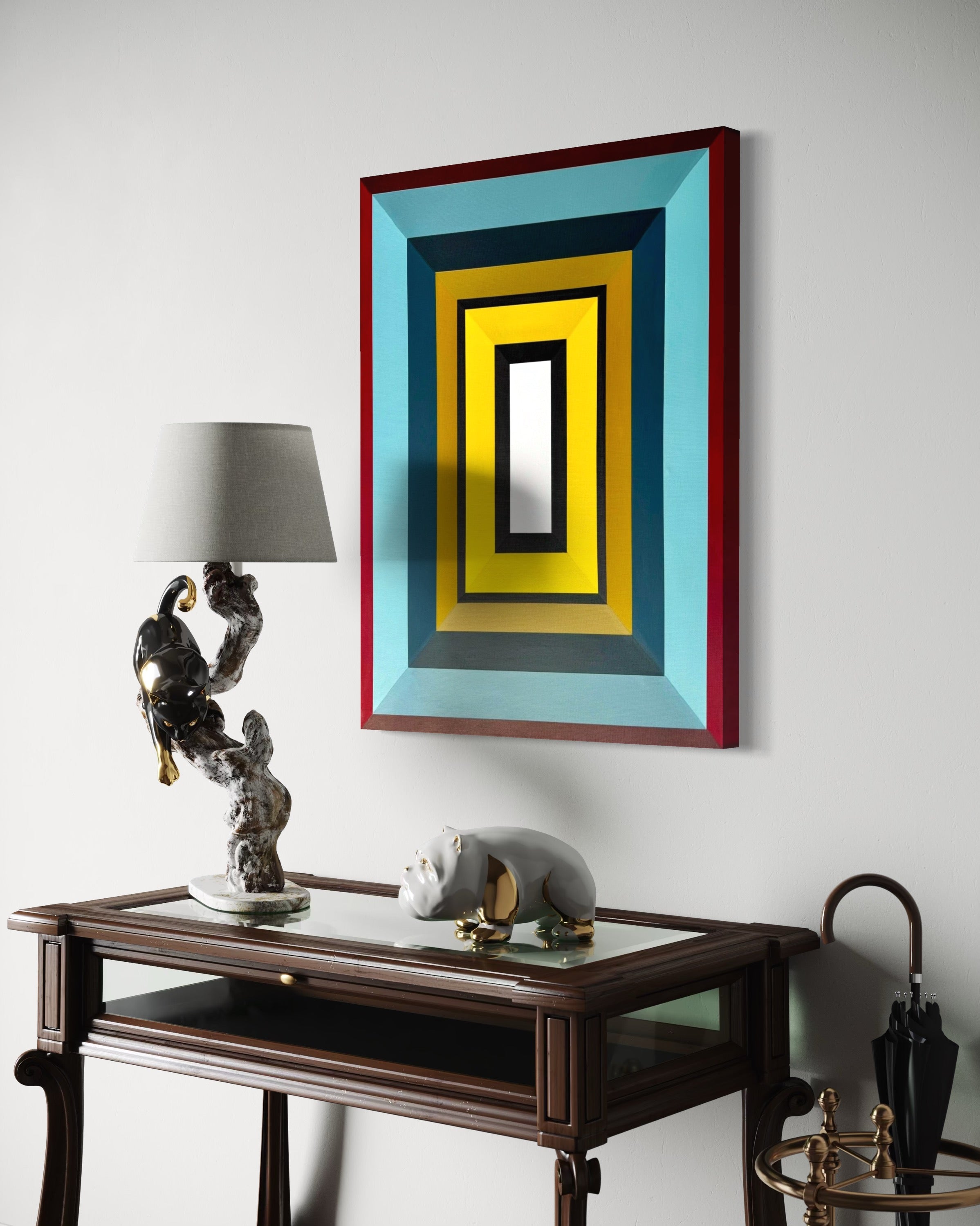Decorative painting with geometric design on a wall above a wooden console table.