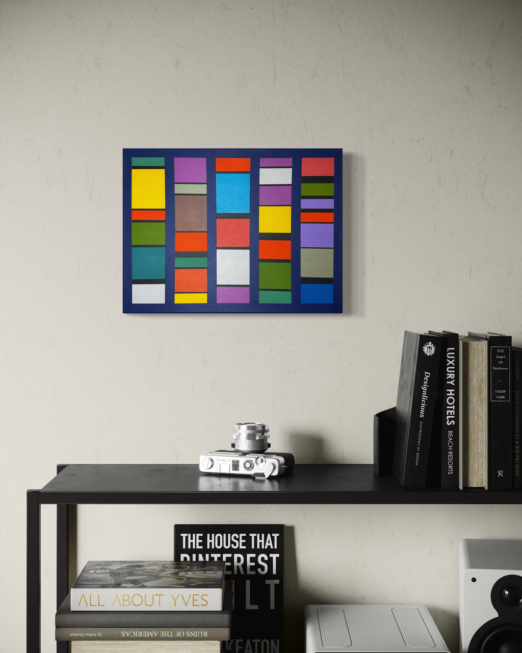 he multi-color "Pulse-Patterns" painting adding a burst of creative energy to a modern home office, hung above a sleek black desk.