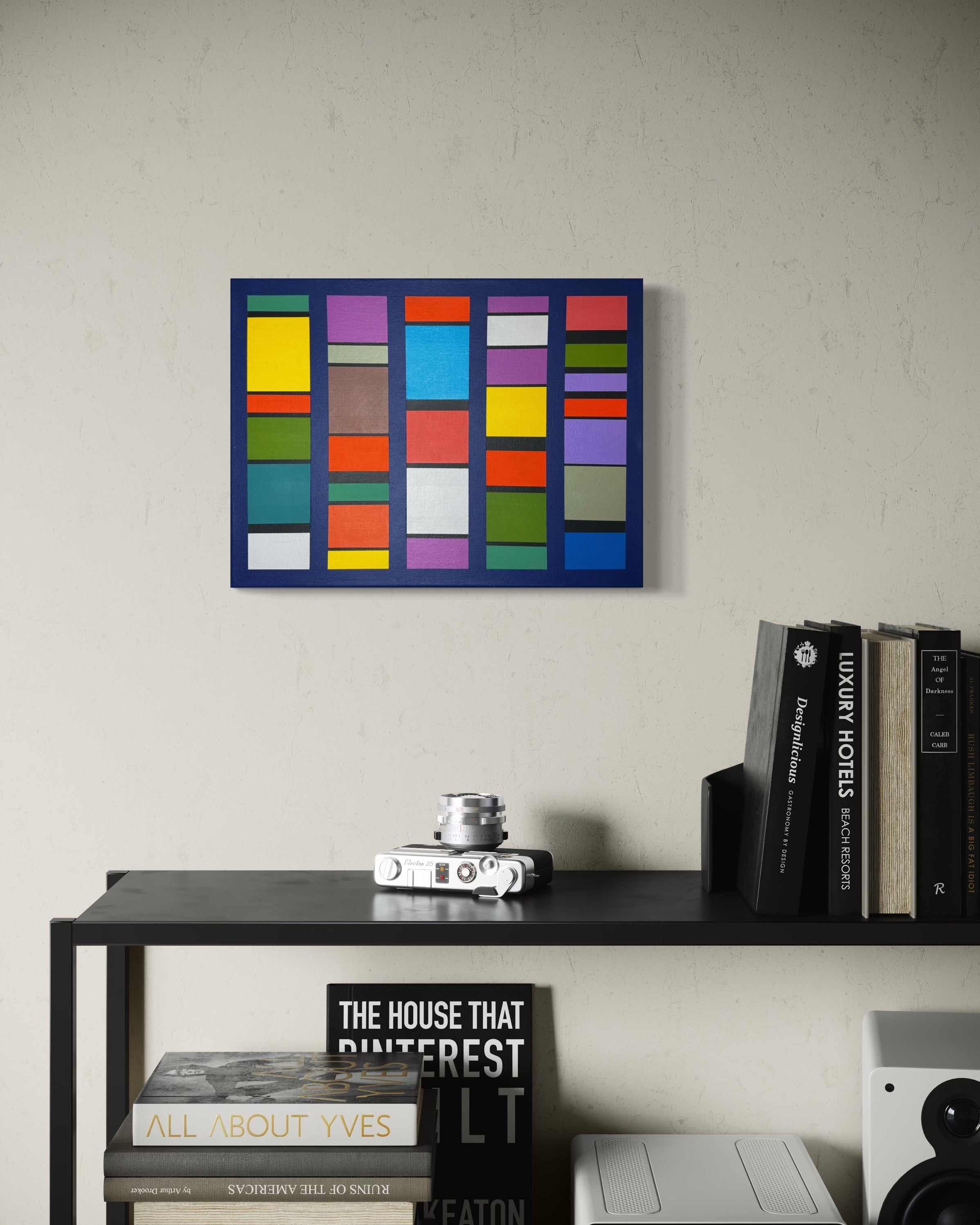 he multi-color "Pulse-Patterns" painting adding a burst of creative energy to a modern home office, hung above a sleek black desk.