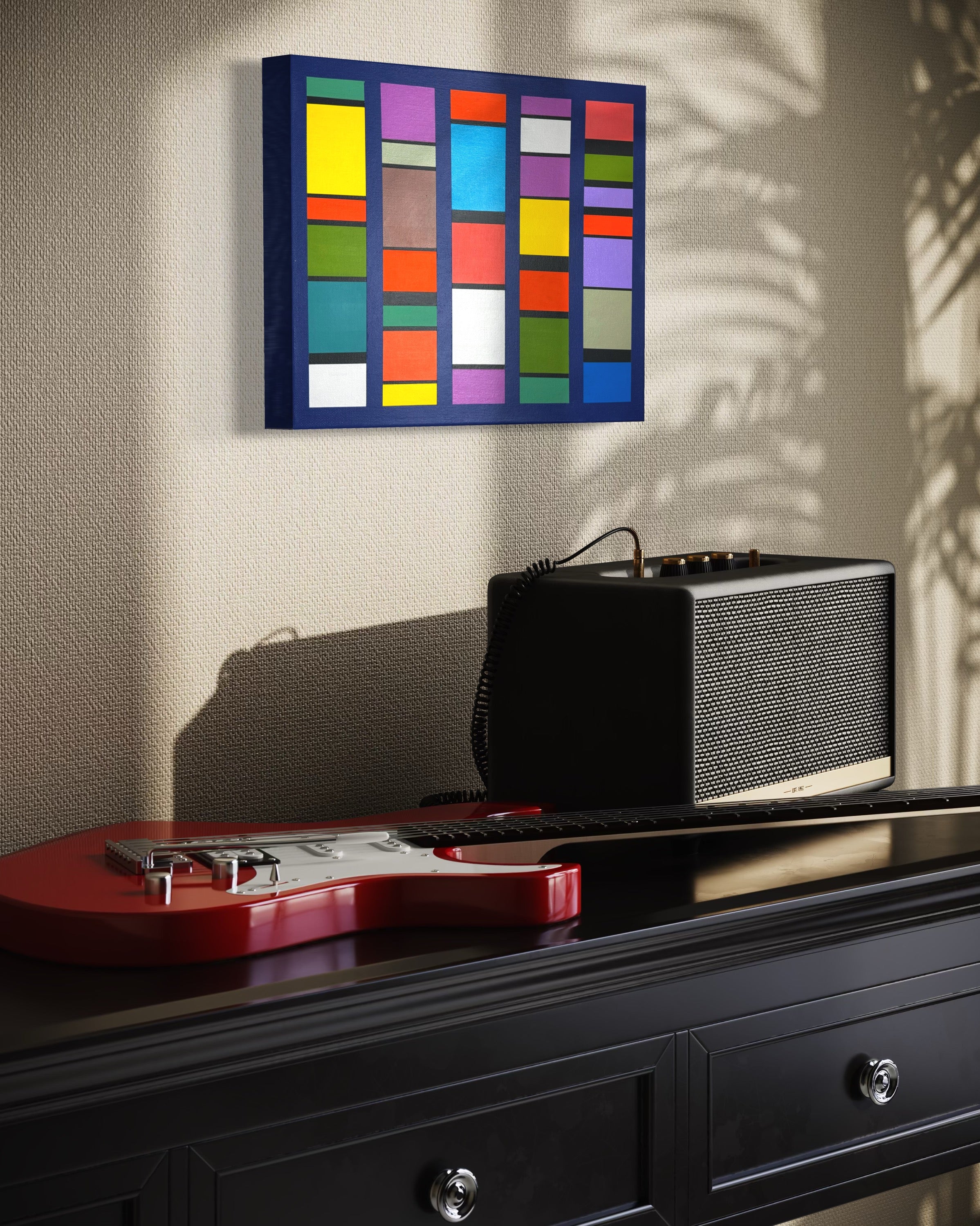 Black radio on a black dresser with a red guitar and colorful abstract  "Pulse-Patterns" painting on the wall.