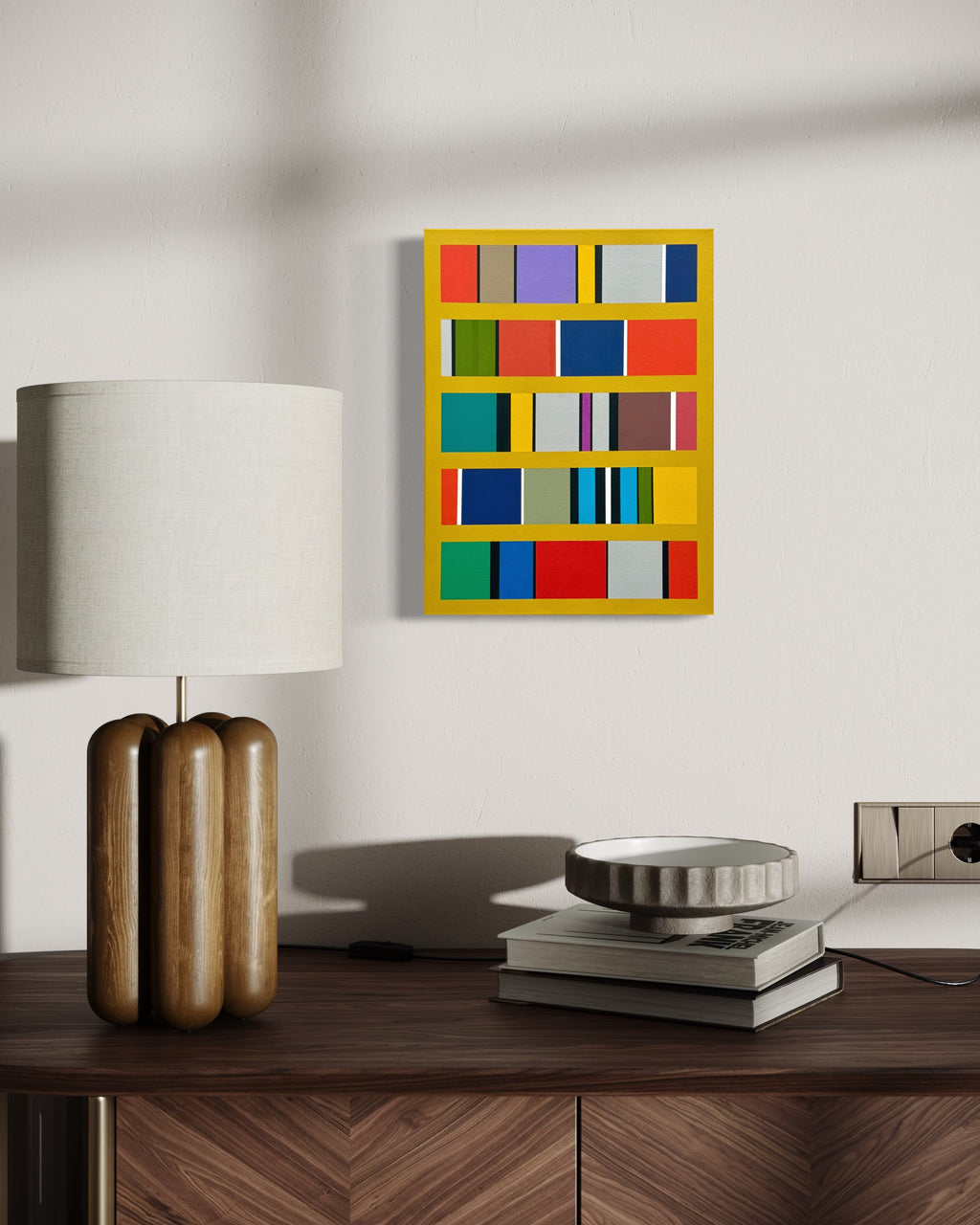 The "Continuum" painting's vibrant yellow and blue tones adding a powerful splash of color to a modern room with warm wood furniture.