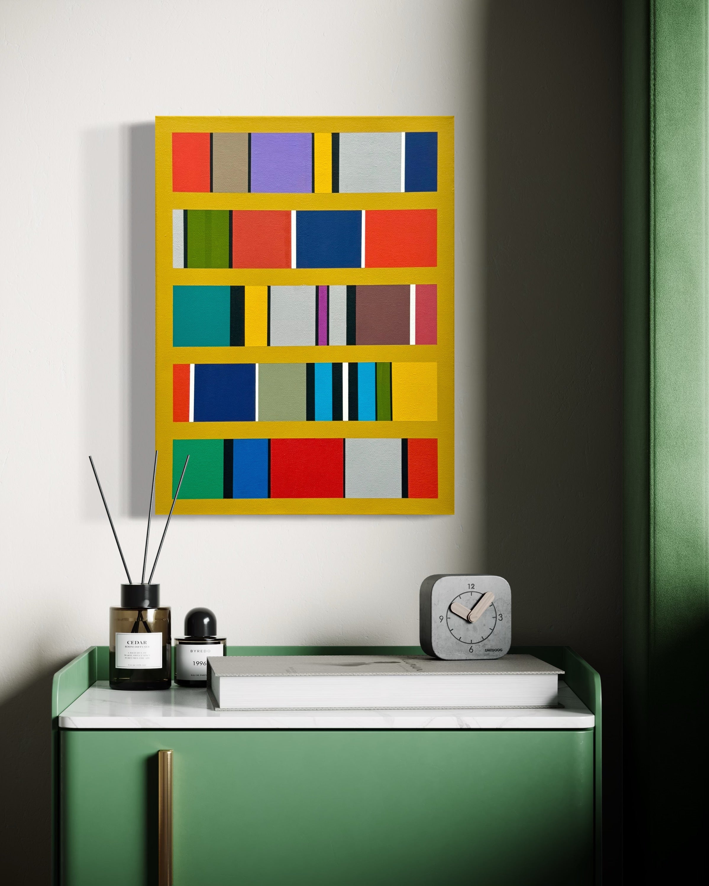 Colorful abstract wall art on a white wall with a green cabinet below.
