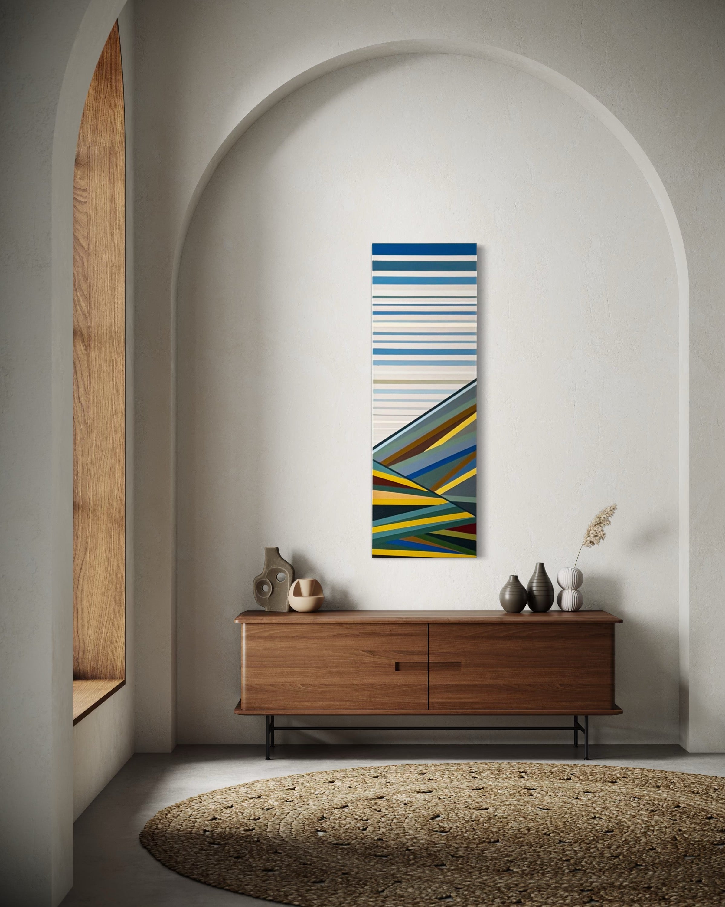 he "Foothills" abstract landscape perfectly accentuating a tall, arched wall niche, adding color and interest to a minimalist architectural space.