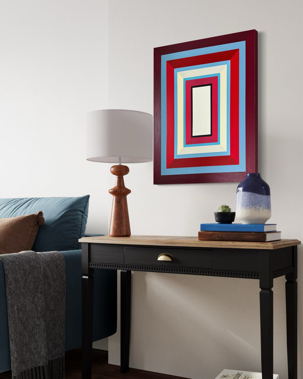 Elena Alexander's "Lady in Red" painting hung above a dark wood console table, adding a touch of sophisticated color to a modern entryway or office.