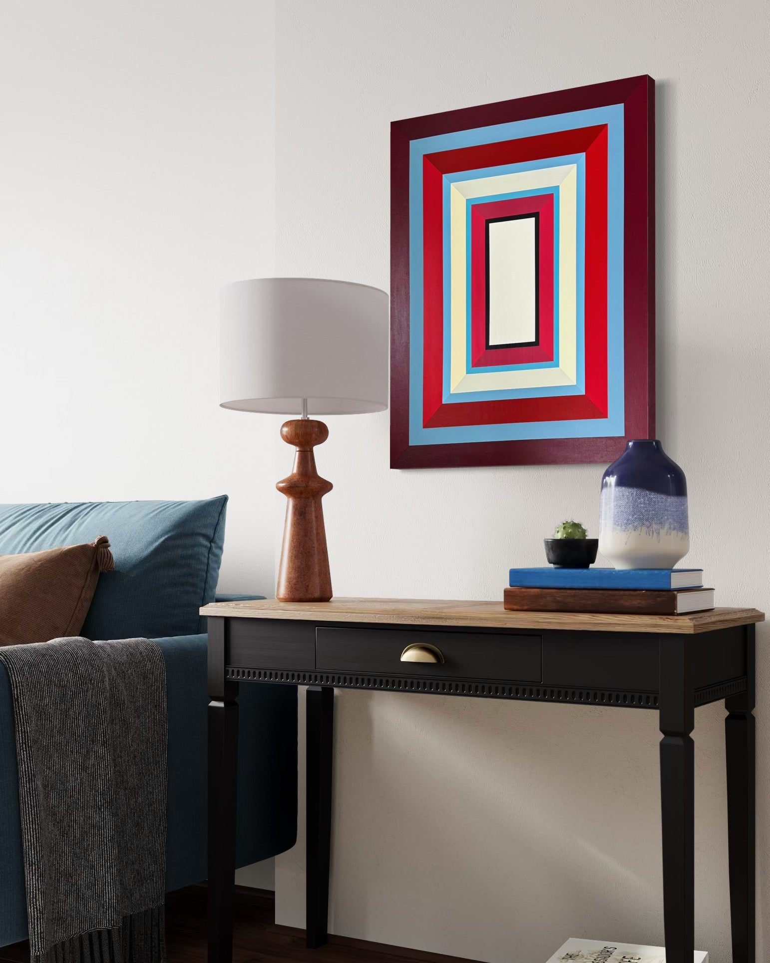 Elena Alexander's "Lady in Red" painting hung above a dark wood console table, adding a touch of sophisticated color to a modern entryway or office.