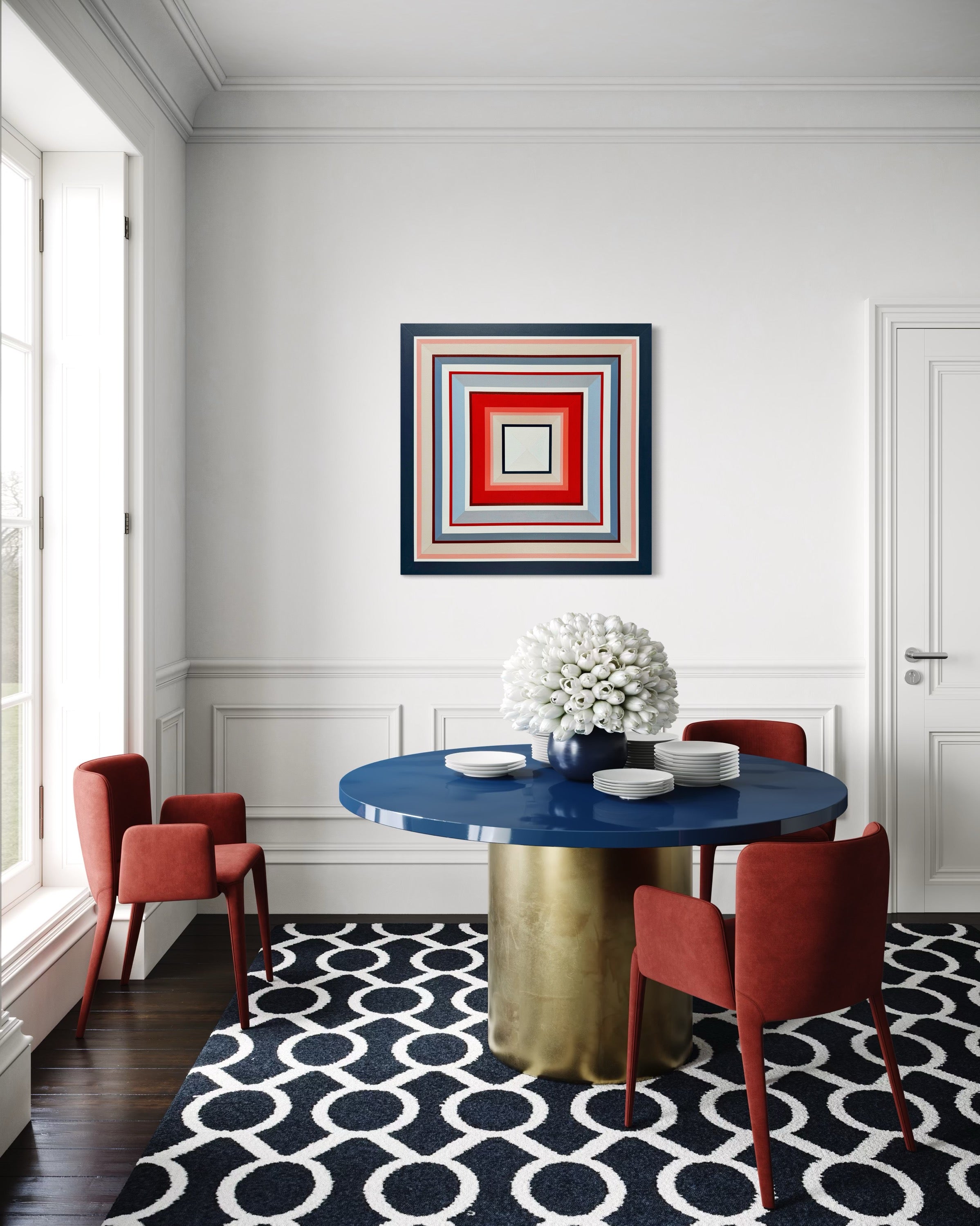The vibrant "In Other Words" painting hung in a chic, modern dining nook, complementing the bold blue table and contemporary red chairs.