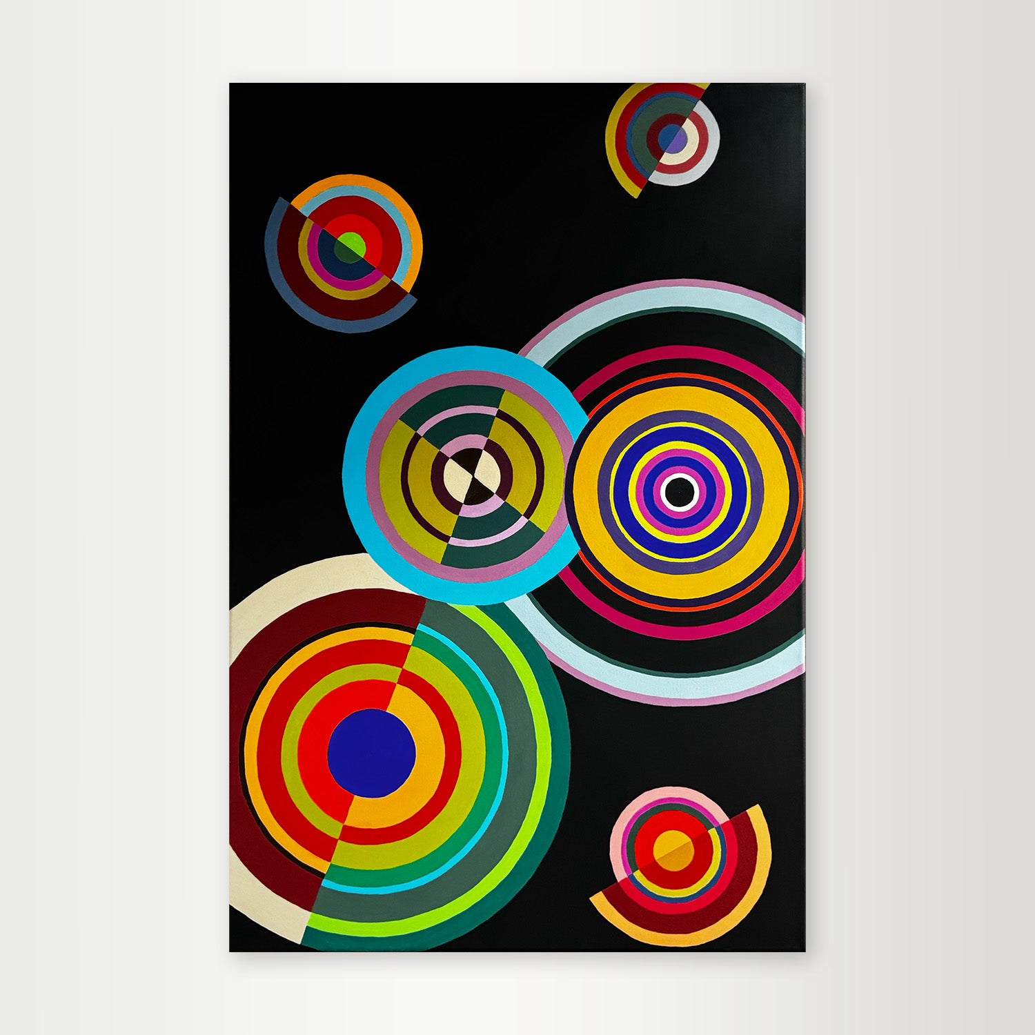"Moving-Targets" - A playful hard-edge geometric abstract by Elena Alexander, featuring colorful concentric circles in orange, blue, and green that resemble targets on a black background.